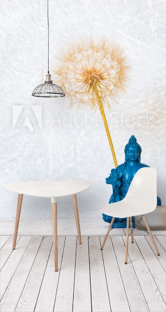 Picture of Buddha burning candle and dandelion flower as zen background